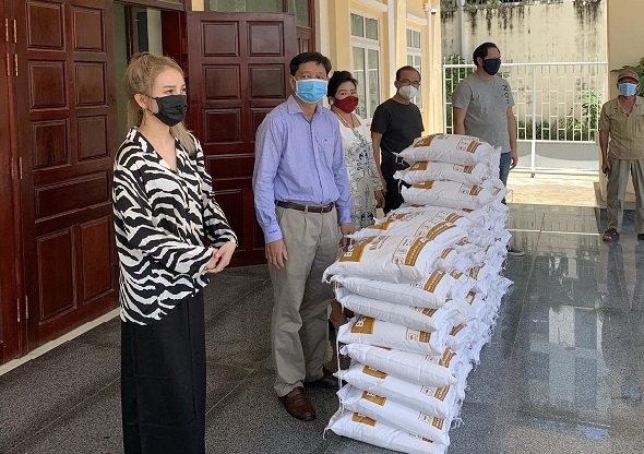 Presenting relief gifts to needy households in Cambodia